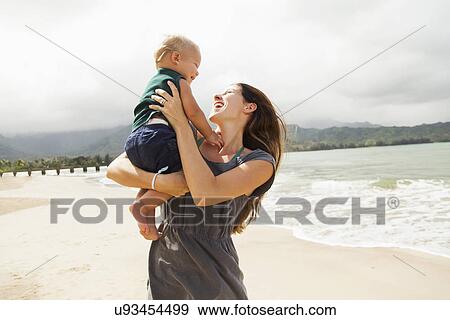 Young mother with baby daughter (6-11 months) View Large Photo Image Stock Photo - Young mother with baby daughter (6-11 months). Fotosearch