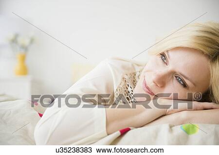 Young woman day dreaming View Large Photo Image Stock Image - Young woman day dreaming. Fotosearch