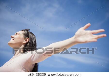 Young woman enjoying sunny weather View Large Photo Image Stock Photo - Young woman enjoying sunny weather. Fotosearch