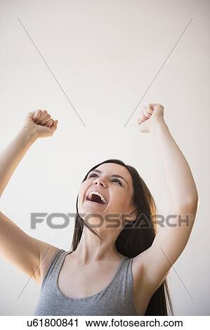 Young woman in victorious gesture View Large Photo Image Stock Image - Young woman in victorious gesture. Fotosearch