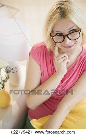 Young woman thinking View Large Photo Image Stock Photo - Young woman thinking. Fotosearch