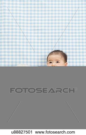 Baby boy sitting with soft toy View Large Photo Image Stock Image - Baby boy sitting with soft toy. Fotosearch