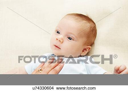 Baby boy supported by hand View Large Photo Image Picture - Baby boy supported by hand. Fotosearch