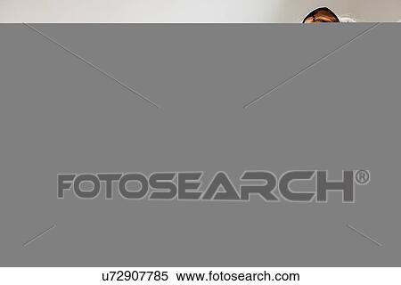 Stock Photography - Beautiful young woman with smartphone. Fotosearch