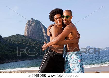 Stock Photo - Best friends on beach, Rio de Janeiro, Brazil. Fotosearch