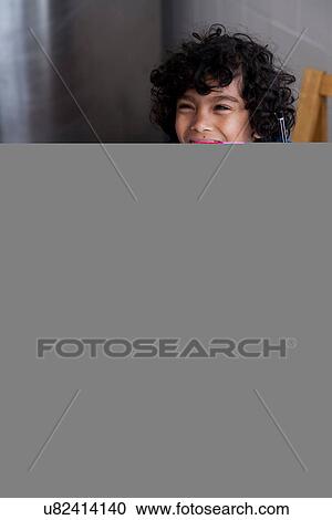 Boy doing homework, person serving snacks and milk View Large Photo Image Stock Image - Boy doing homework, person serving snacks and milk. Fotosearch