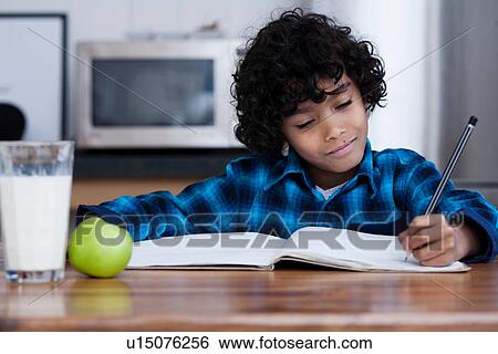 Boy doing homework View Large Photo Image Stock Photograph - Boy doing homework. Fotosearch