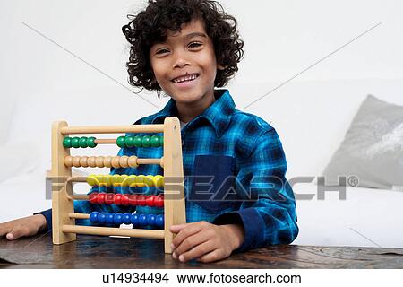 Boy playing with abacus View Large Photo Image Picture - Boy playing with abacus. Fotosearch