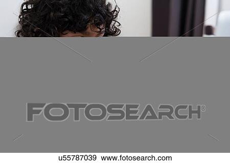 Boy using laptop View Large Photo Image Stock Photo - Boy using laptop. Fotosearch