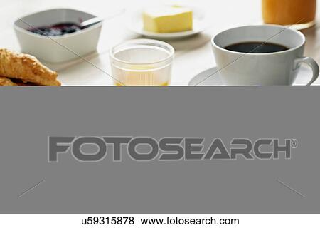 Breakfast with croissant, coffee and orange juice View Large Photo Image Stock Photo - Breakfast with croissant, coffee and orange juice. Fotosearch