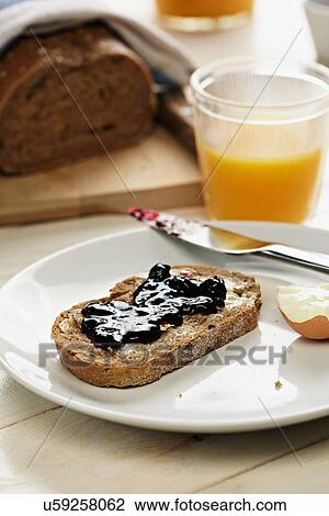 Breakfast with toast and jam and orange juice View Large Photo Image Stock Image - Breakfast with toast and jam and orange juice. Fotosearch