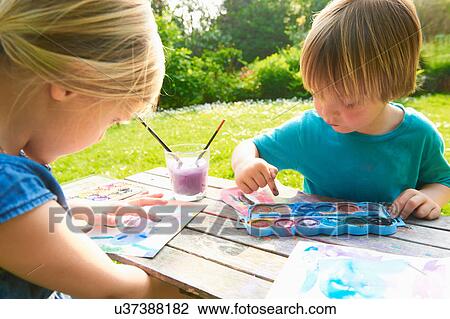 Brother and sister finger painting in garden View Large Photo Image Stock Image - Brother and sister finger painting in garden. Fotosearch