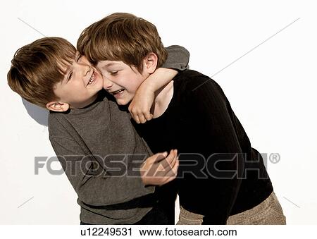 Stock Image - Brothers play fighting. Fotosearch