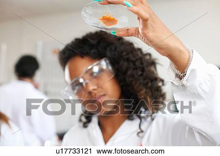 Chemistry student holding chemical View Large Photo Image Stock Image - Chemistry student holding chemical. Fotosearch