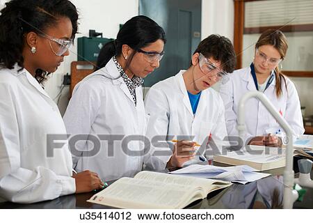 Chemistry teacher and students with text books View Large Photo Image Stock Image - Chemistry teacher and students with text books. Fotosearch