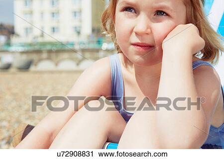 Child daydreaming on beach View Large Photo Image Stock Image - Child daydreaming on beach. Fotosearch