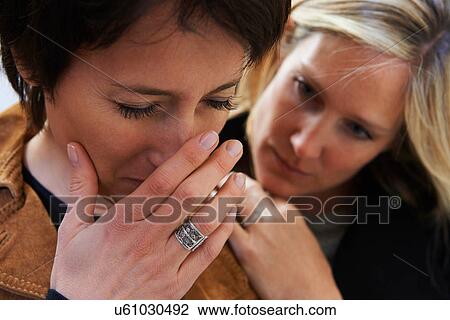 Close up of anxious woman with supportive friend View Large Photo Image Stock Image - Close up of anxious woman with supportive friend. Fotosearch