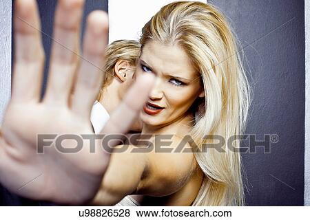Close up of young angry woman with hand in front of camera View Large Photo Image Stock Photo - Close up of young angry woman with hand in front of camera. Fotosearch