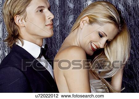 Stock Image - Close up of young couple flirting. Fotosearch