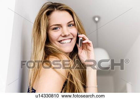 Close up portrait of young woman using mobile phone View Large Photo Image Stock Image - Close up portrait of young woman using mobile phone. Fotosearch