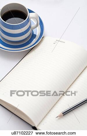 Stock Photo - Coffee and open diary. Fotosearch