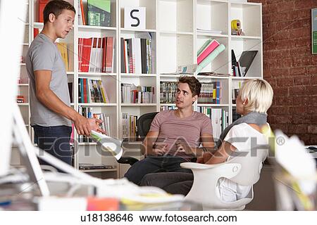 Colleagues having meeting View Large Photo Image Stock Photograph - Colleagues having meeting. Fotosearch