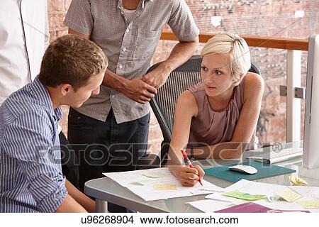 Picture - Colleagues in meeting. Fotosearch