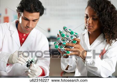 Stock Photo - College students holding molecular models. Fotosearch