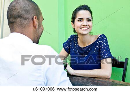 Couple at table outside cafe View Large Photo Image Stock Photograph - Couple at table outside cafe. Fotosearch