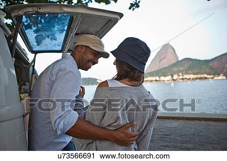 Couple by campervan, Rio de Janeiro, Brazil View Large Photo Image Stock Image - Couple by campervan, Rio de Janeiro, Brazil. Fotosearch