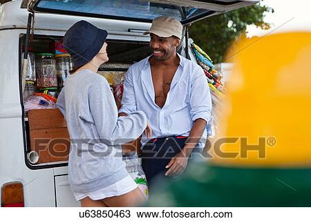 Couple by campervan View Large Photo Image Stock Image - Couple by campervan. Fotosearch