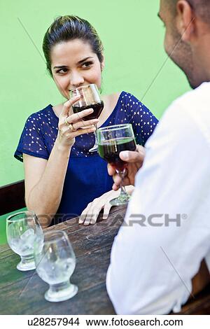 Picture - Couple having red wine. Fotosearch