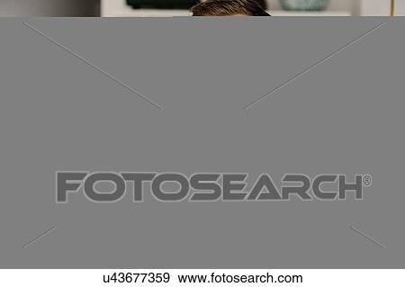 Stock Photo - Couple looking at camera. Fotosearch