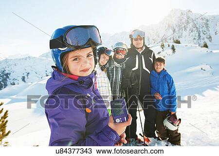 Stock Image - Family of skiers, Les Arcs, Haute-Savoie, France. Fotosearch