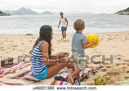 Family on beach with ball View Large Photo Image Stock Photo - Family on beach with ball. Fotosearch