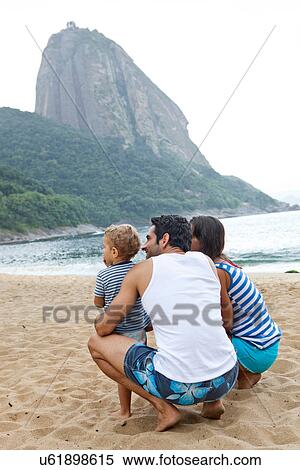 Family on beach with Sugarloaf Mountain, Rio de Janeiro, Brazil View Large Photo Image Stock Photography - Family on beach with Sugarloaf Mountain, Rio de Janeiro, Brazil. Fotosearch