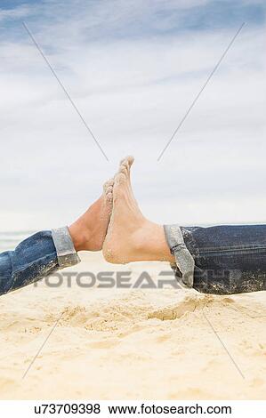 Father and daughter's bare feet on beach View Large Photo Image Stock Photo - Father and daughter's bare feet on beach. Fotosearch