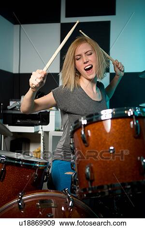 Female drummer performing View Large Photo Image Stock Photo - Female drummer performing. Fotosearch