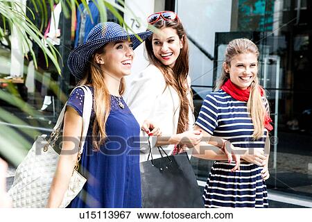 Female friends going shopping together View Large Photo Image Stock Photo - Female friends going shopping together. Fotosearch