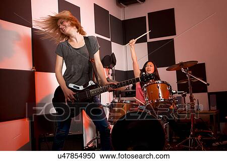Stock Image - Female music band performing. Fotosearch