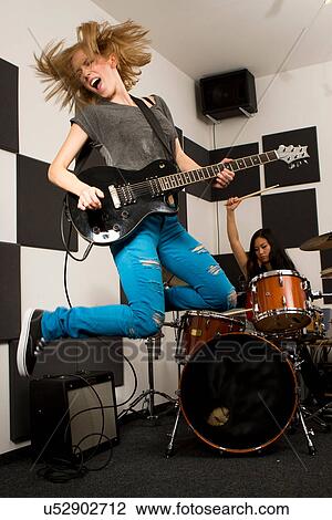 Stock Image - Female music band performing. Fotosearch
