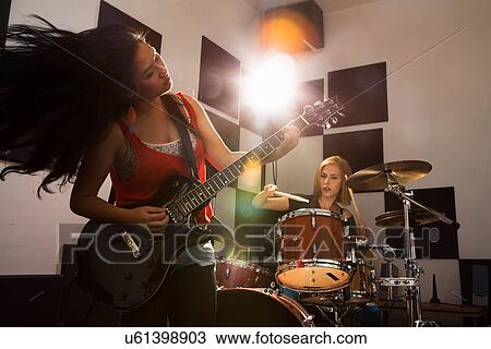 Female music band performing View Large Photo Image Stock Image - Female music band performing. Fotosearch
