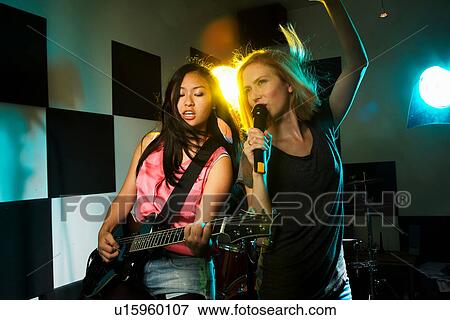 Female music band performing View Large Photo Image Stock Photo - Female music band performing. Fotosearch