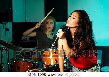 Female music band performing View Large Photo Image Stock Photo - Female music band performing. Fotosearch
