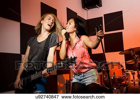 Female music band performing View Large Photo Image Stock Photo - Female music band performing. Fotosearch