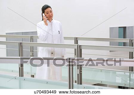 Female scientist in laboratory using mobile phone View Large Photo Image Stock Photo - Female scientist in laboratory using mobile phone. Fotosearch
