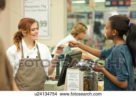 Female shop assistant handing bill to customer View Large Photo Image Picture - Female shop assistant handing bill to customer. Fotosearch
