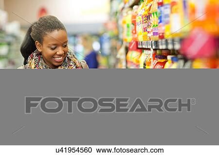 Female shopper and daughter in supermarket View Large Photo Image Stock Image - Female shopper and daughter in supermarket. Fotosearch