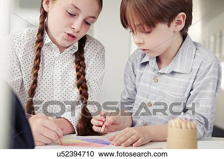 Girl and boy drawing together View Large Photo Image Stock Image - Girl and boy drawing together. Fotosearch
