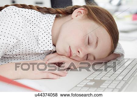 Girl asleep on computer keyboard View Large Photo Image Stock Photo - Girl asleep on computer keyboard. Fotosearch